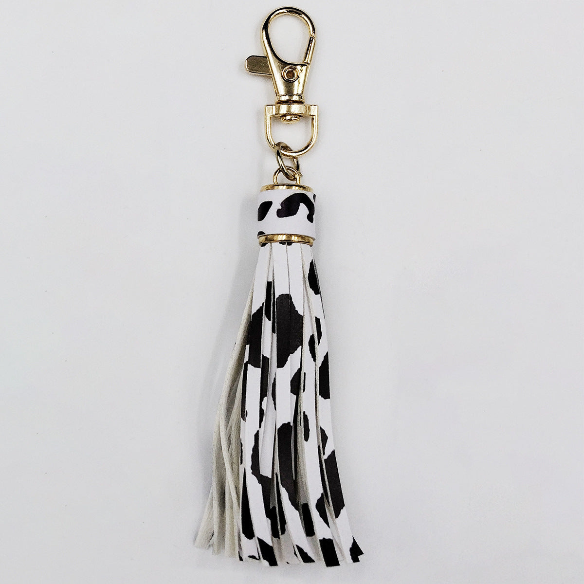 Llavero al por mayor de la borla del cuero del modelo de la vaca del leopardo de la PU